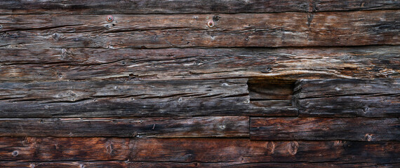 Part ancient wooden wall. Vintage background. Natural old wood background. Elements of old architecture. Weathered old wooden vintage barn. Vintage toned. Empty template.