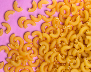 Macaroni elbow noodles pastel background