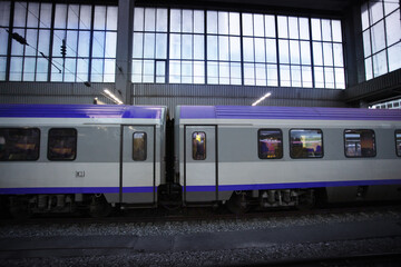Two intercity train cars standing on the station