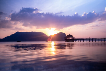 Naklejka na ściany i meble Calm sea at sunset on the Malaysian island of Langkawi 