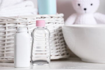 Baby cosmetic products on white table, space for text