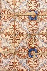 old damaged tiles in Portugal, blue,brown and white, photography takes in buildings of Portugal