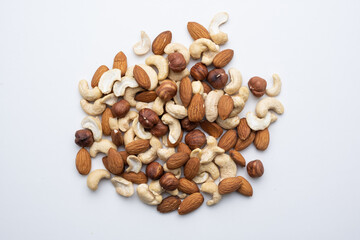 Different nuts on a white background top view close-up.