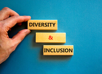 D and I, Diversity and inclusion symbol. Concept words D and I, diversity and inclusion on blocks on beautiful blue table blue background. Business, D and I, diversity and inclusion concept.
