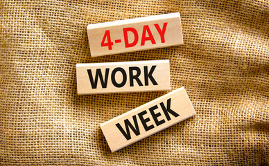 4-day work week symbol. Concept words 4-day work week on wooden blocks on beautiful canvas table, canvas background. Copy space. Business and 4-day work week and short workweek concept.