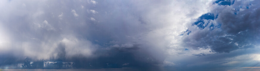 blue sky with rain clouds
