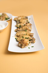 Chicken Wing Appetizer with Garlic Parmesan and Celery Sticks 