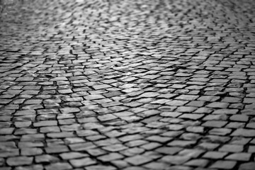 Cobblestone street in Iserlohn Sauerland Germany. Wheathered historic basalt ashlars or blocks in a...
