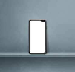 Mobile phone on grey wall shelf. Square background