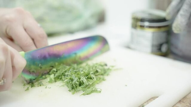 person cutting parsley