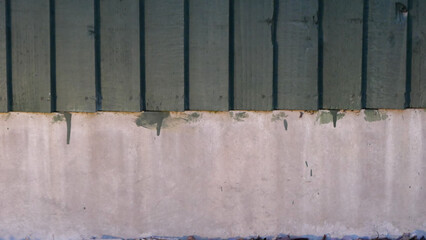 Fototapeta na wymiar View of painted wooden fence above concrete with copy space