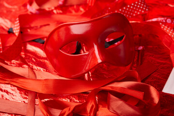 red mask and red ribbons