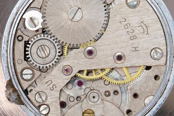 The internal mechanism of a mechanical watch. Gears.