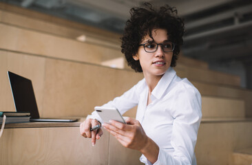 Millennial girl working in coworking office space