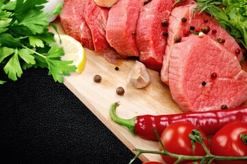 Raw organic meat on a slate board. Food concept