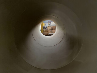 Fragment of a metallurgical plant with a large-diameter pipe in the foreground. Selective focus. Copy space