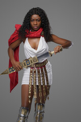 African roman woman warrior with wavy hairs and gladius