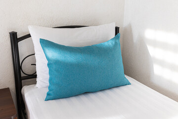 interior Two beds in a hotel room. white and blue pillows on a white sheet