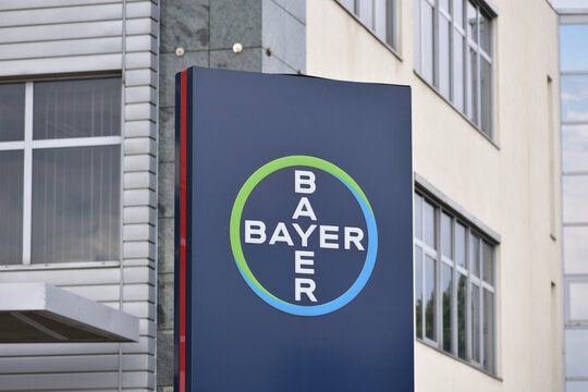 Bayer building with emblem and logo, branch of famous German pharmaceutical company. WARSAW, POLAND - AUGUST 19, 2021