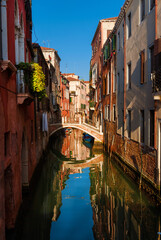 Fototapeta na wymiar View of characteristic Venice canal with old traditional and colorful houses