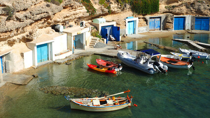 Fototapeta na wymiar Beautiful fishermen seaside village of Mandrakia with colourful boat houses called 