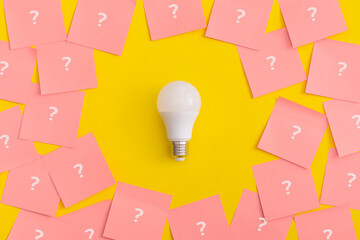 Light bulb on yellow background. Inspiration and creative idea concept.