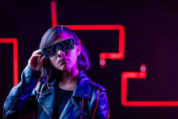 cyberpunk gamer in futuristic glasses near red neon lighting, virtual reality and metaverse concept - obrazy, fototapety, plakaty