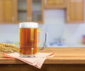 Glass of beer with foam Served in stylish old brick wall interior.