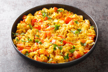 Classic Indian breakfast, egg Bhurji is a spicy mouth watering spin on scrambled eggs closeup in...