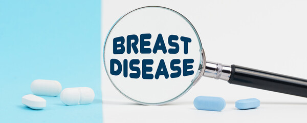 On a blue and white background, there are pills and a magnifying glass, inside of which it is written - BREAST DISEASE