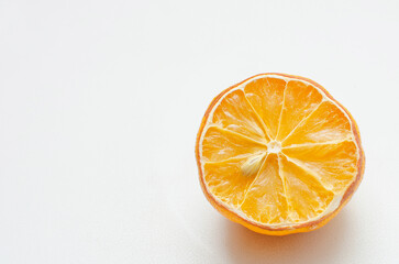 Sliced wilted lemon on a white background. Place for text, copyspace.
