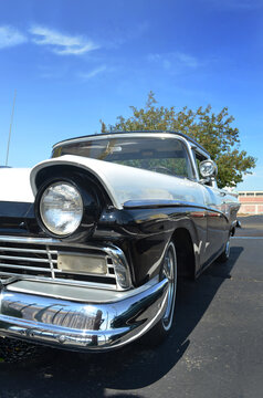 Vintage car with single headlight visible portrait style 