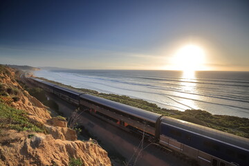 Amtrak trains along the San Diego coastline at dusk