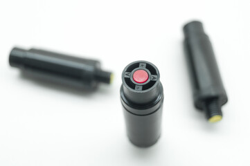 Aerosol pepper cartridges for a protective gun. Means of self-defense against attacks by aggressive people and animals. Selective focus, isolated on white, copy space