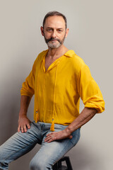 Stylish handsome grey bearded senior on casual clothes