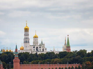 Fototapeta na wymiar Beautiful view of Red Square with Moscow Kremlin and St. Basil's Cathedral in rainy summer. This is main tourist destination in Moscow. Beautiful panorama of heart of city.
