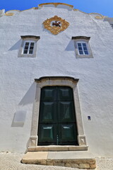 Fototapeta na wymiar Saint James church-green door-plaster medallion depicting Sao Tiago. Tavira-Algarve-Portugal-082