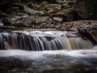 Fototapeta premium Waterfall on river Ilse in forest Harz, Germany