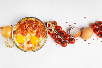 Turkish shakshuka on a white background