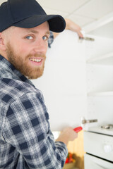 contractor repairman working in the kitchen