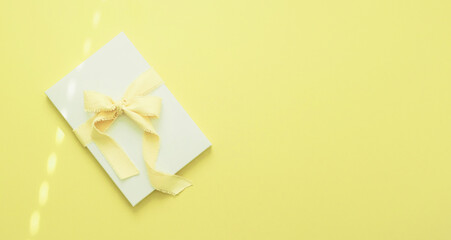 Gift Box on Solid Yellow Background