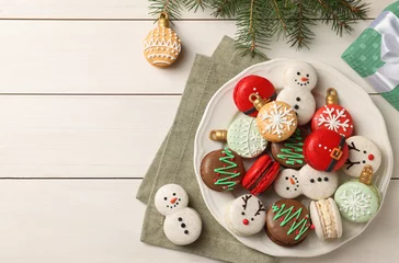 Fotobehang Beautifully decorated Christmas macarons and fir branches on white wooden table, flat lay. Space for text © New Africa