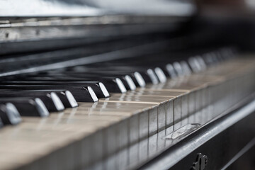 Selective focus, vintage piano background close-up, musical instrument.