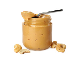 Glass jar of creamy cashew butter and nuts on white background