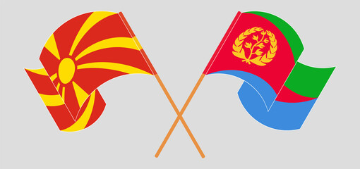 Fototapeta na wymiar Crossed and waving flags of North Macedonia and Eritrea