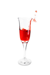Transparent wineglass with red wine splash up with drops, isolated on white background