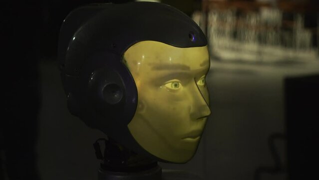 Concept of artificial intelligence and modern technologies in robotics. HDR. Close up of human like head of a robot.