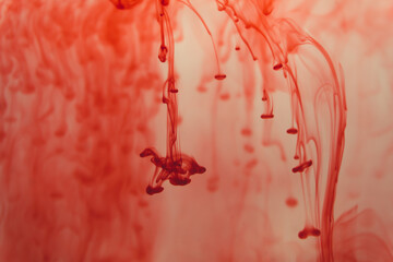 Red ink in the water abstract background. swirls of paint in liquid