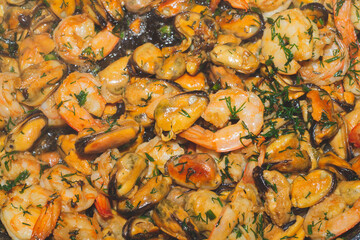 Fried prawns and mussels. grilled seafood close up