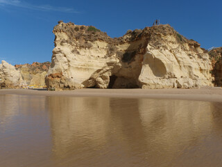 Fototapeta na wymiar A section of the idyllic Praia de Rocha beach on the Algarve region.